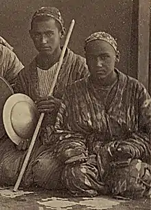 Batcha, or Dancing Boys, one with a tas cymbal, one with two pairs of qairaq.
