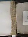 Manuscript leaf used as hinge reinforcement