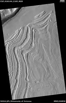 Well-developed hollows, as seen by HiRISE under the HiWish program.  Hollows are on floor of a crater with concentric crater fill.  Location is Casius quadrangle.
