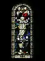 Stained glass window behind the altar