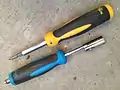 Multi-bit screwdriver and F connector tool.