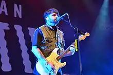 A man playing guitar