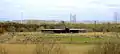 Visitor centre and picnic and play area seen from hill