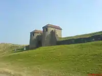 The reconstructed gateway of the castrum, the Porta Praetoria, from a distance.