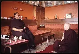 Rangjung Rigpe Dorje, the 16th Karmapa, seated, with a monk, at Rumtek Monastery, Sikkim in 1965.