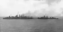 Image 31American destroyers evacuating the crew of HMAS Canberra after the Battle of Savo Island (from History of the Royal Australian Navy)