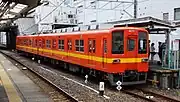 Two-car set 8577 in orange and yellow livery in April 2016
