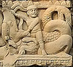 Foreigner with headband fighting a Makara. Torana of Stupa 3 in Sanchi.
