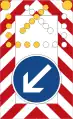 Moveable road barrier with flashing arrow
